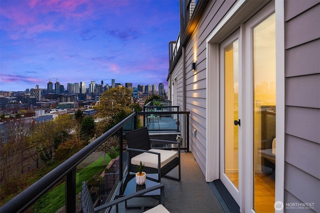 1416 6th Ave N, Seattle, WA 98109 - balcony at dusk featuring a view of skyline