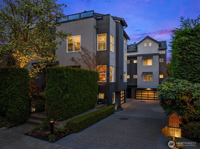 1416 6th Ave N, Seattle, WA 98109 - modern home with stucco siding, driveway, and an attached garage