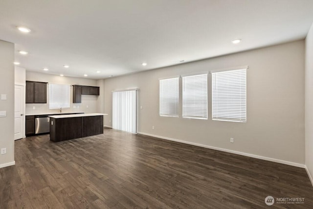 28303 74th Dr NW Unit 88, Stanwood, WA 98292 - unfurnished living room with dark wood-style flooring and recessed lighting