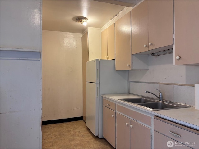 8020 S D St, Tacoma, WA 98408 - kitchen featuring light countertops, decorative backsplash, and freestanding refrigerator