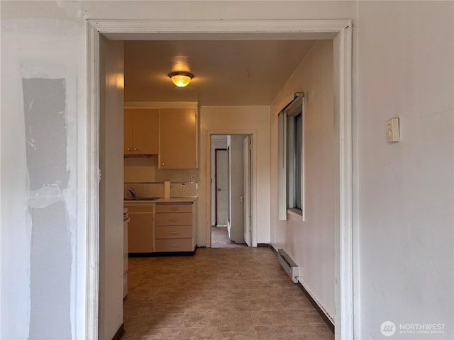 8020 S D St, Tacoma, WA 98408 - hallway featuring a baseboard heating unit and a sink