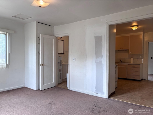8020 S D St, Tacoma, WA 98408 - empty room with light colored carpet and water heater