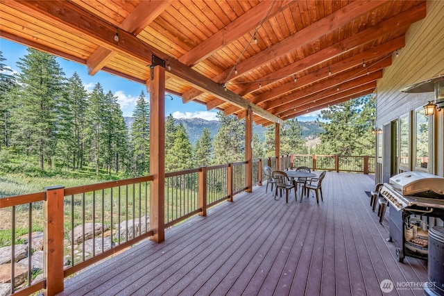 239 Foxridge Ln, Leavenworth, WA 98826 - wooden deck featuring outdoor dining space, area for grilling, and a mountain view
