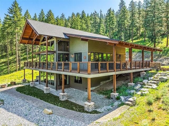 239 Foxridge Ln, Leavenworth, WA 98826 - back of house featuring a deck and a view of trees