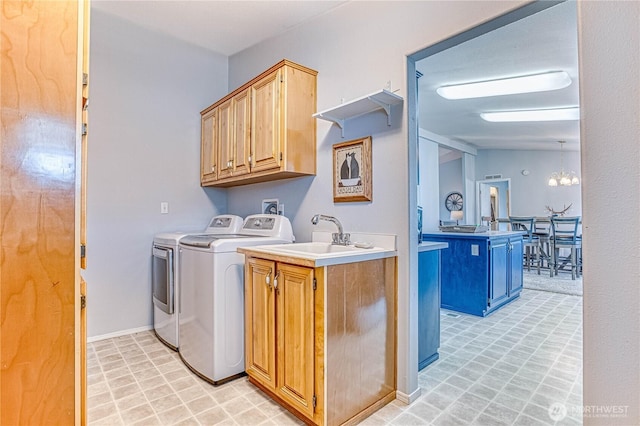 1630 Pleasant Ave Unit 21, Wenatchee, WA 98801 - laundry area with washing machine and dryer, cabinet space, and a chandelier