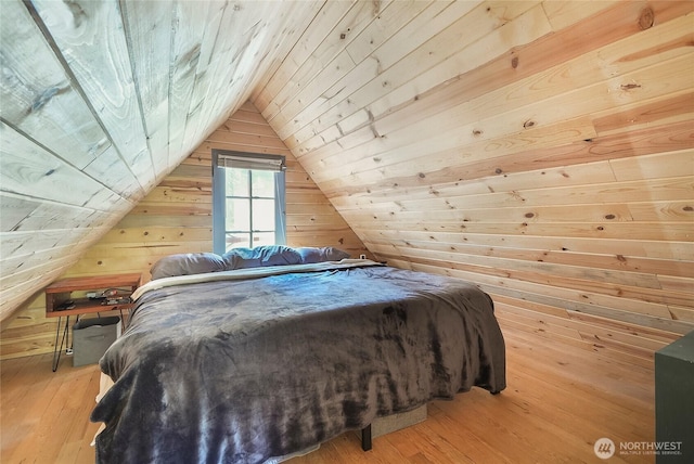 13990 Brae Burn Rd, Leavenworth, WA 98826 - bedroom featuring wooden walls, vaulted ceiling, light wood-style flooring, and wooden ceiling