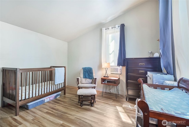 13990 Brae Burn Rd, Leavenworth, WA 98826 - bedroom with lofted ceiling, wood finished floors, and cooling unit