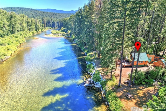 13990 Brae Burn Rd, Leavenworth, WA 98826 - drone / aerial view of a heavily wooded area and a mountainous background