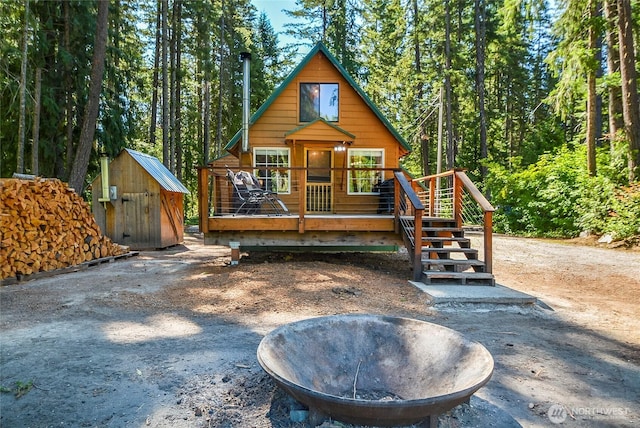 13990 Brae Burn Rd, Leavenworth, WA 98826 - rustic home featuring a deck and a storage unit