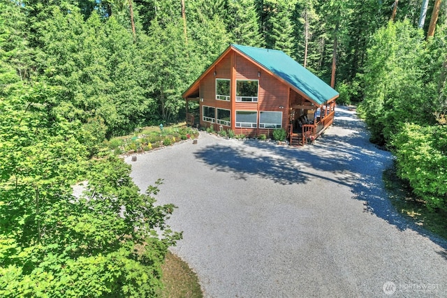 2115 Chiwawa Ct, Leavenworth, WA 98826 - rustic home with stairs, a forest view, and asphalt driveway