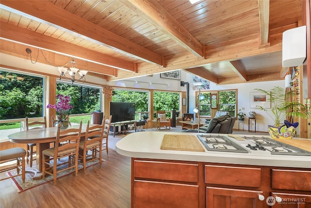 2115 Chiwawa Ct, Leavenworth, WA 98826 - kitchen with light wood-style flooring, light countertops, a wood ceiling with exposed beams, a chandelier, and healthy amount of natural light
