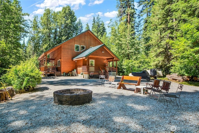 2115 Chiwawa Ct, Leavenworth, WA 98826 - view of patio / terrace with a fire pit, a deck, and stairs