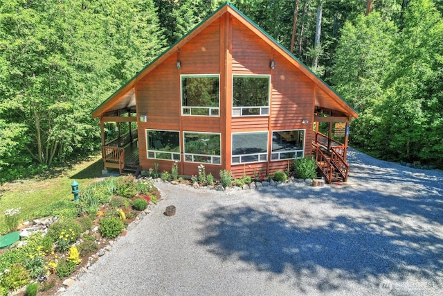 2115 Chiwawa Ct, Leavenworth, WA 98826 - chalet / cabin featuring driveway, a forest view, and stairs