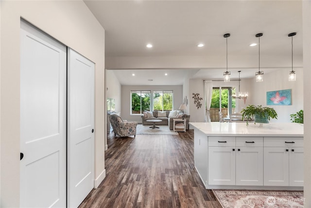 10 Coyote Rd, Montesano, WA 98563 - kitchen with dark wood-style flooring, light countertops, white cabinetry, hanging light fixtures, and recessed lighting