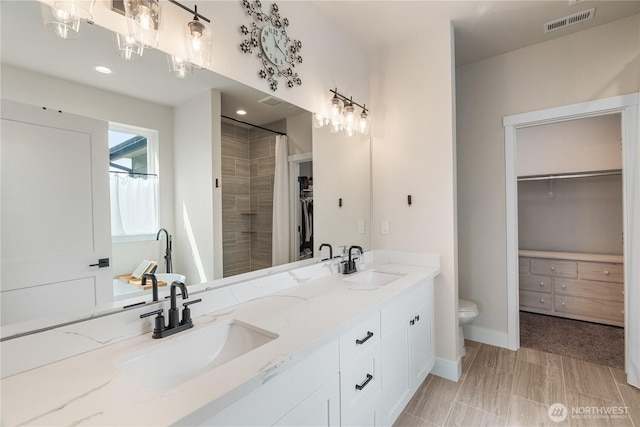10 Coyote Rd, Montesano, WA 98563 - bathroom featuring double vanity, a spacious closet, a shower with curtain, and recessed lighting