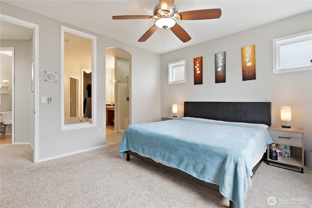 17915 25th Ave E, Tacoma, WA 98445 - carpeted bedroom featuring arched walkways and a ceiling fan