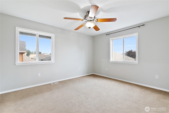 17915 25th Ave E, Tacoma, WA 98445 - spare room with a ceiling fan and carpet