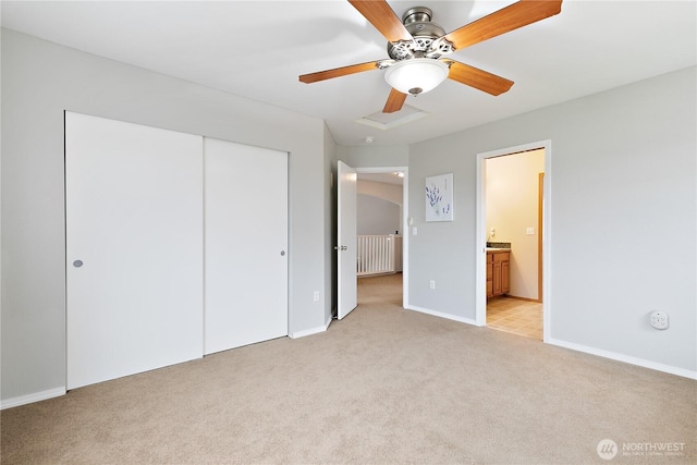 17915 25th Ave E, Tacoma, WA 98445 - unfurnished bedroom featuring light colored carpet, a closet, ensuite bathroom, and a ceiling fan