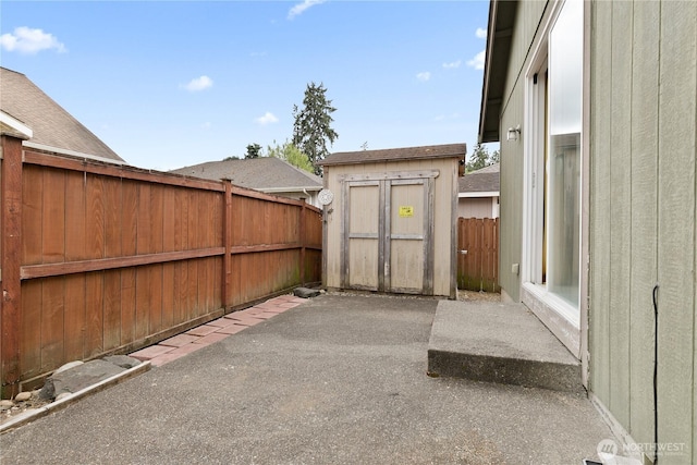 17915 25th Ave E, Tacoma, WA 98445 - fenced backyard with a storage unit and a patio area
