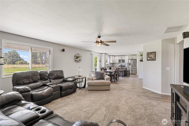 11389 Thompson Rd NE, Moses Lake, WA 98837 - living room featuring a ceiling fan, light wood finished floors, and recessed lighting