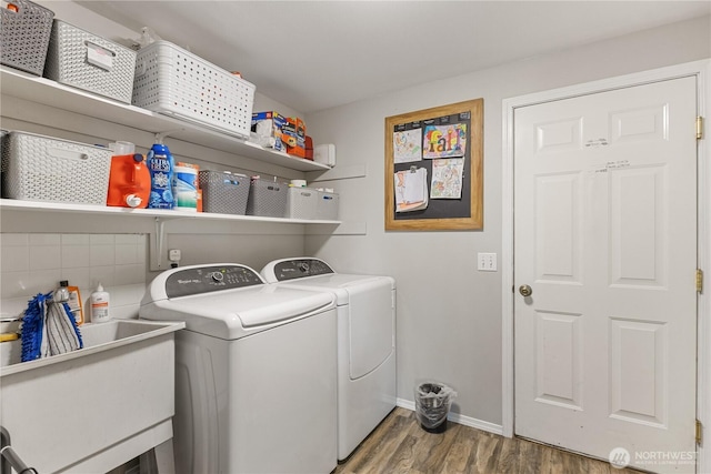 11389 Thompson Rd NE, Moses Lake, WA 98837 - laundry area with washer and clothes dryer and wood finished floors