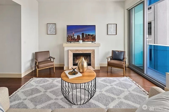 737 Olive Way Unit 3110, Seattle, WA 98101 - living area with wood finished floors and a premium fireplace