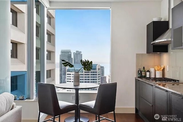 737 Olive Way Unit 3110, Seattle, WA 98101 - dining room with a view of city and dark wood-style flooring