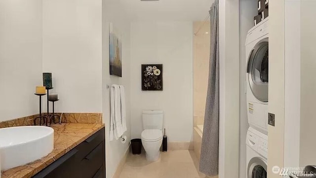 737 Olive Way Unit 3110, Seattle, WA 98101 - bathroom featuring stacked washer and clothes dryer, vanity, and shower / bath combination with curtain
