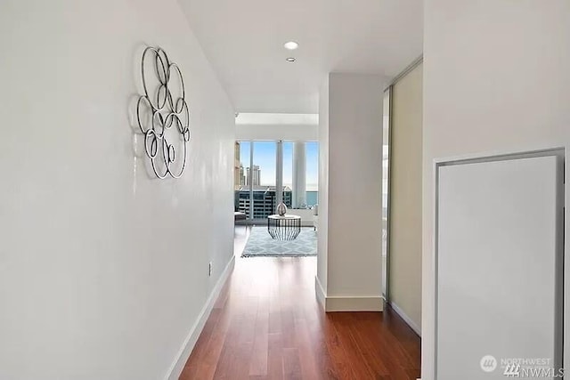737 Olive Way Unit 3110, Seattle, WA 98101 - hall featuring dark wood finished floors and baseboards