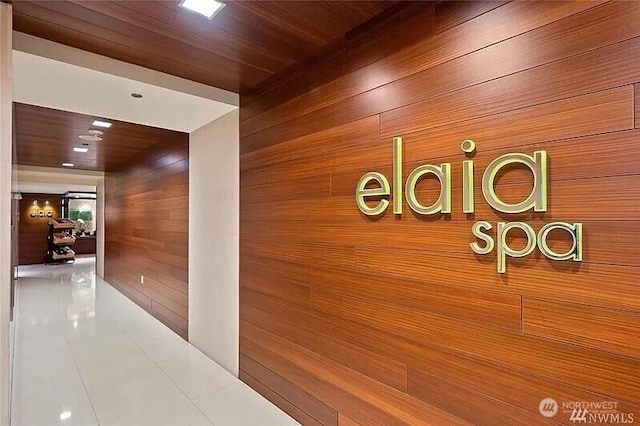 737 Olive Way Unit 3110, Seattle, WA 98101 - corridor featuring wood walls and tile patterned floors