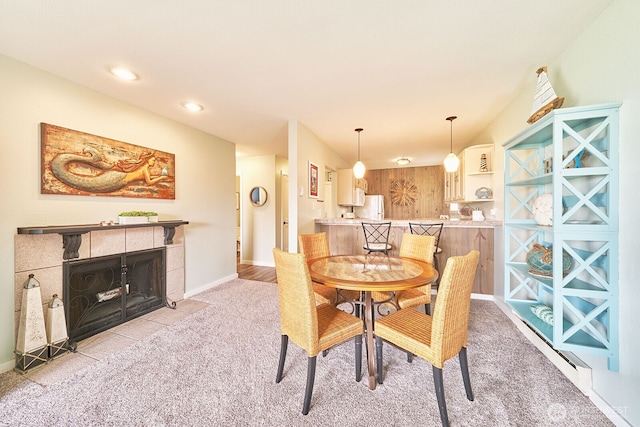 210 26th St NW Unit 428, Long Beach, WA 98631 - dining space featuring light colored carpet and a tiled fireplace