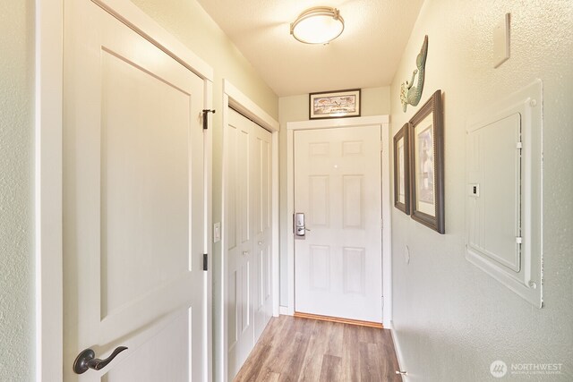210 26th St NW Unit 428, Long Beach, WA 98631 - doorway to outside with light wood finished floors