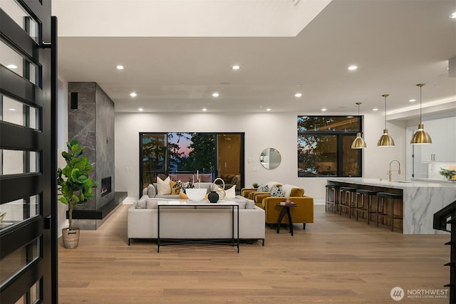 4719 86th Ave SE, Mercer Island, WA 98040 - living room featuring light wood-type flooring, recessed lighting, and a premium fireplace