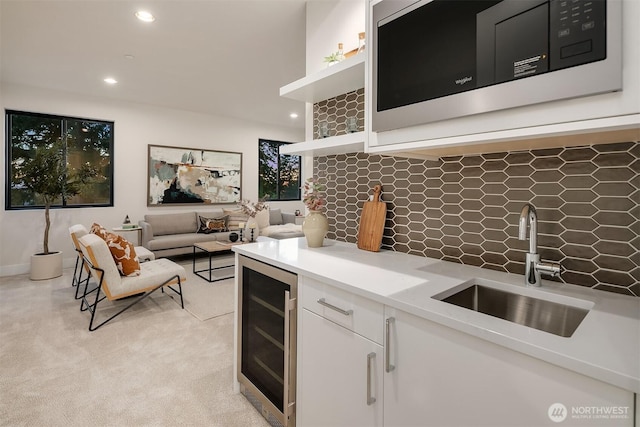 4719 86th Ave SE, Mercer Island, WA 98040 - kitchen with stainless steel microwave, beverage cooler, tasteful backsplash, open shelves, and white cabinets
