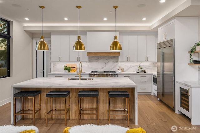 4719 86th Ave SE, Mercer Island, WA 98040 - kitchen featuring stainless steel built in refrigerator, beverage cooler, backsplash, white cabinets, and recessed lighting