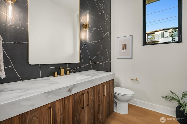4719 86th Ave SE, Mercer Island, WA 98040 - bathroom featuring vanity, wood finished floors, and backsplash
