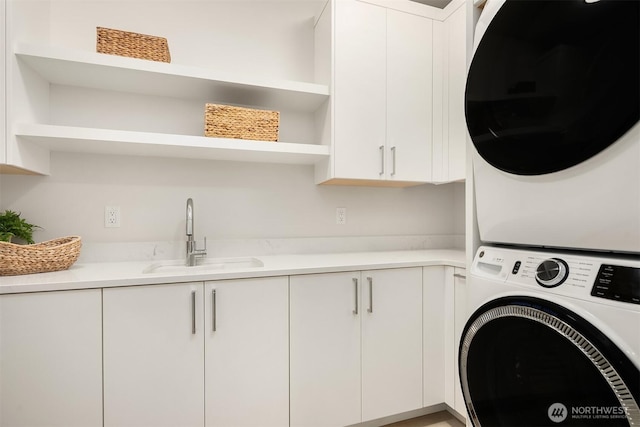 4719 86th Ave SE, Mercer Island, WA 98040 - laundry area with stacked washer / drying machine and cabinet space