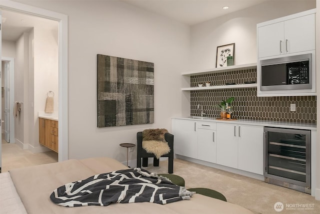 4719 86th Ave SE, Mercer Island, WA 98040 - indoor wet bar featuring wine cooler, stainless steel microwave, tasteful backsplash, light carpet, and recessed lighting