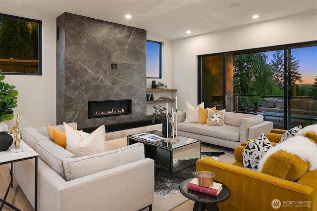 4719 86th Ave SE, Mercer Island, WA 98040 - living room featuring recessed lighting, wood finished floors, a high end fireplace, and plenty of natural light