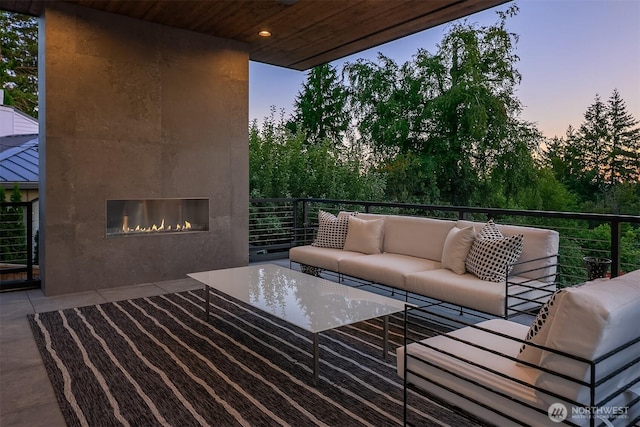4719 86th Ave SE, Mercer Island, WA 98040 - patio terrace at dusk with an outdoor living space with a fireplace