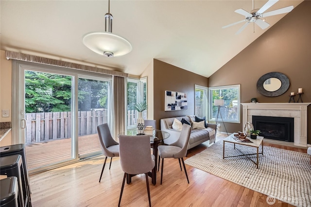 31451 48th Pl SW, Federal Way, WA 98023 - dining area featuring light wood-style floors, a premium fireplace, high vaulted ceiling, and ceiling fan