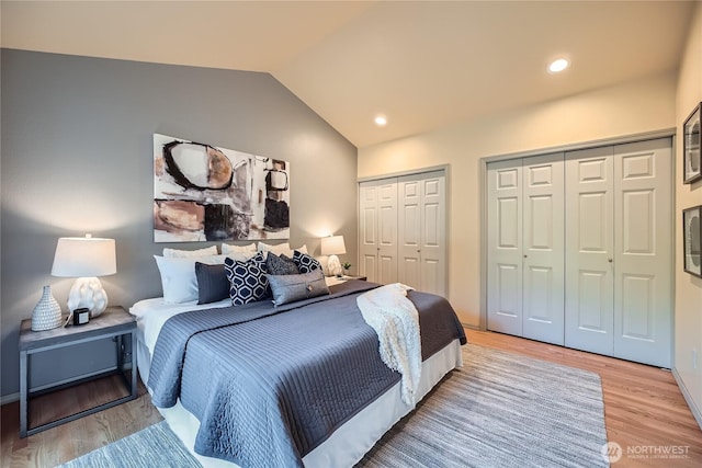 31451 48th Pl SW, Federal Way, WA 98023 - bedroom featuring two closets, light wood finished floors, vaulted ceiling, and recessed lighting