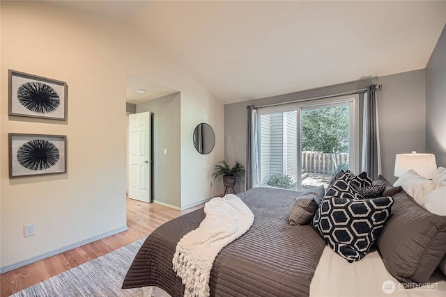 31451 48th Pl SW, Federal Way, WA 98023 - bedroom featuring vaulted ceiling, light wood-type flooring, and access to outside