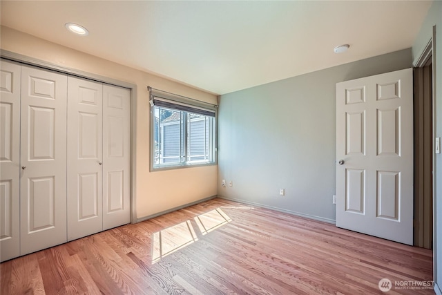 31451 48th Pl SW, Federal Way, WA 98023 - unfurnished bedroom featuring light wood-type flooring and a closet