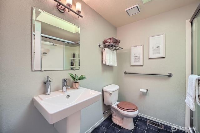 31451 48th Pl SW, Federal Way, WA 98023 - bathroom featuring tile patterned flooring and an enclosed shower
