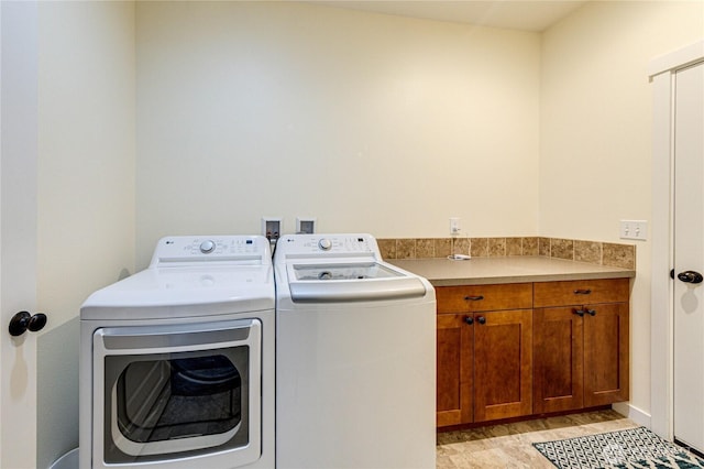 31 Nimbus Ln, Sequim, WA 98382 - laundry room featuring independent washer and dryer and cabinet space