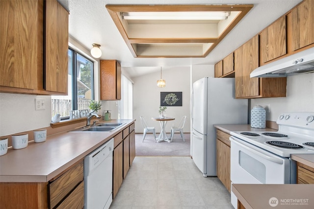 2528 S 363rd St, Federal Way, WA 98003 - kitchen featuring white appliances, light carpet, brown cabinets, and light countertops