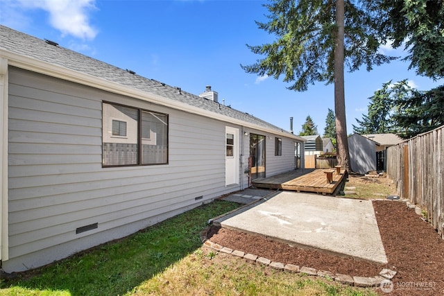 2528 S 363rd St, Federal Way, WA 98003 - back of house with a wooden deck, a patio, a fenced backyard, a storage shed, and a chimney