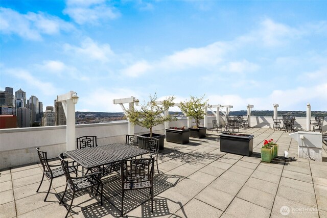 121 Vine St Unit 402, Seattle, WA 98121 - view of patio with outdoor dining space