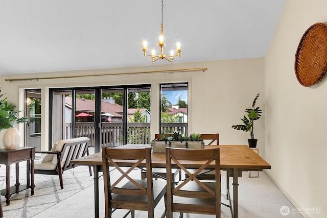 1541 NE 143rd St Unit H5, Seattle, WA 98125 - dining room featuring a chandelier and light colored carpet